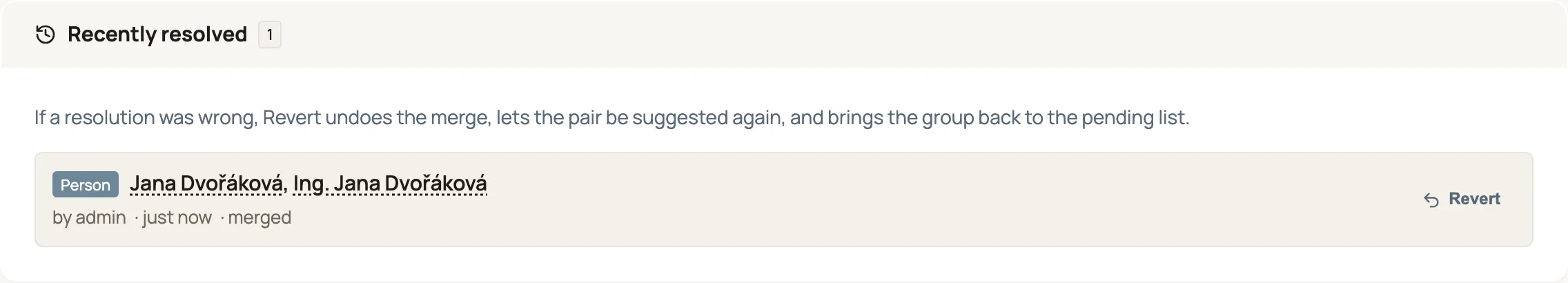 The Recently resolved panel at the bottom of the Possible duplicate records page. It explains that reverting undoes the merge and brings the group back to the pending list, and lists one resolved Person group — "Jana Dvořáková, Ing. Jana Dvořáková", by admin, just now, merged — with a Revert action on the right.